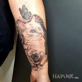 Tattoo Kitty on the forearm motif: animals style: realistic