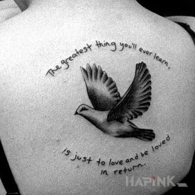 Tattoo Inscription on back and dove on the back motif: lettering