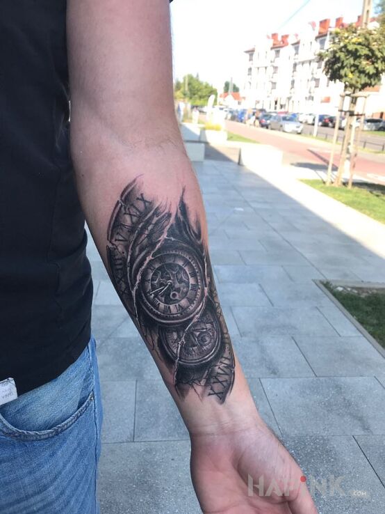 Tattoo Dzieci in black and gray motif and realistic style on the forearm