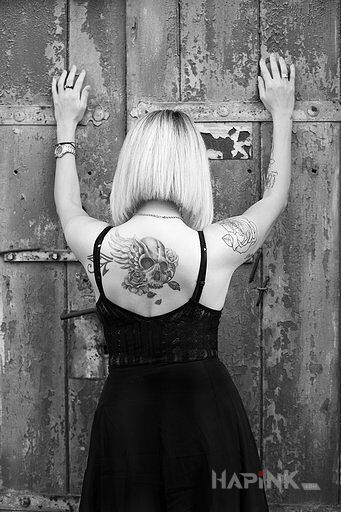 Tattoo Ponadczasowy in flowers motif and graphic / illustrative style on the back