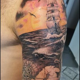Tattoo Maritime climate on the upper arm motif: colorful style: realistic