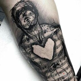 Tattoo Love of music on the forearm motif: black and gray style: graphic / illustrative