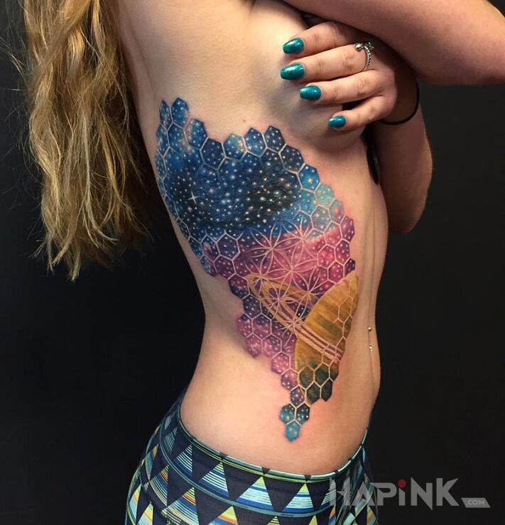 Tattoo Mkro kosmos in cosmos motif on the ribs
