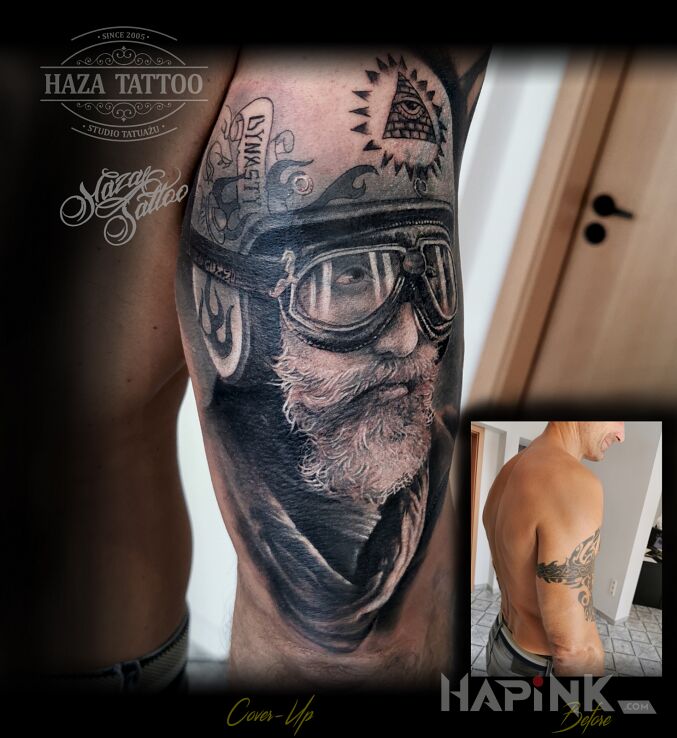 Tattoo Cover moto in cover-up motif and realistic style on the upper arm
