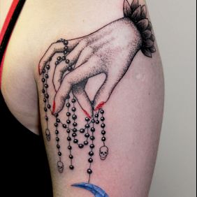 Tattoo Moon on the upper arm motif: skulls style: graphic / illustrative