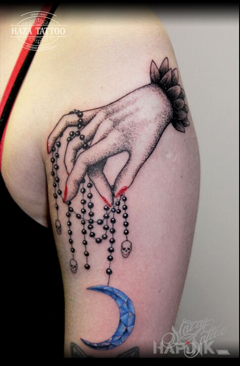 Tattoo Moon in colorful motif and graphic / illustrative style on the upper arm