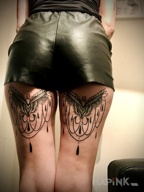 Tattoo Idealny in ornaments motif and graphic / illustrative style on the leg