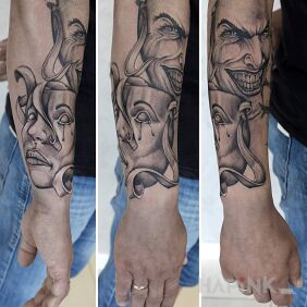 Tattoo Two people two characters on the forearm motif: black and gray style: graphic / illustrative