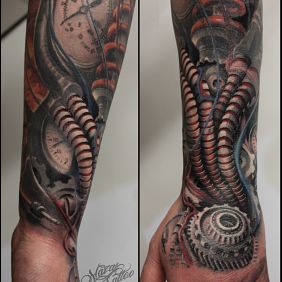 Tattoo Biomechhanika on the forearm motif: colorful style: biomechanics