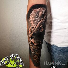 Tattoo Lion on the forearm motif: colorful style: realistic