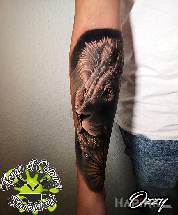 Tattoo Lew in 3D motif and realistic style on the forearm