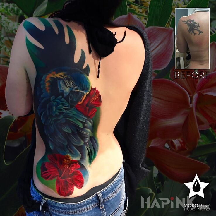 Tattoo Papuga vs old tribal :) in cover-up motif and realistic style on the back
