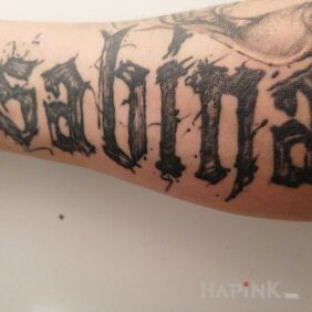 Tattoo So as not to forget what the wife's name is ? on the forearm motif: black and gray style: calligraphy