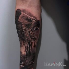 Tattoo Bear on the forearm motif: black and gray style: realistic