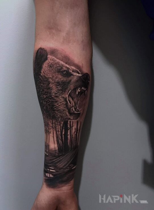 Tattoo Niedźwiadek in black and gray motif and realistic style on the forearm