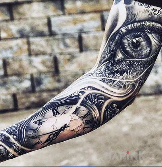Tattoo Spojrzenie na zegar in black and gray motif and realistic style on the forearm