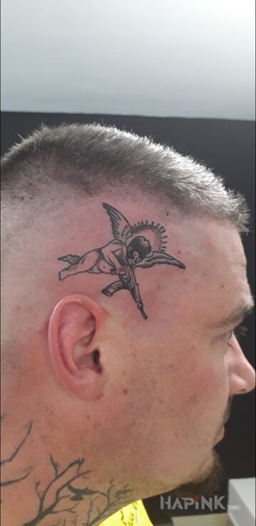 Tattoo Aniołek in angels motif and ignorant style on the head