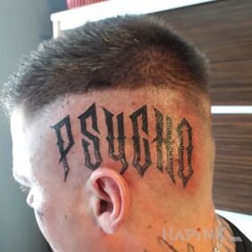 Tattoo Psycho on the head motif: lettering style: calligraphy