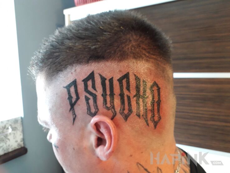 Tattoo Psycho in lettering motif and calligraphy style on the head