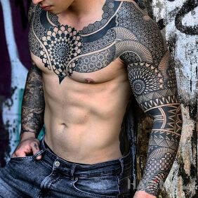 Tattoo Geometric magic on the chest motif: mandalas style: geometric