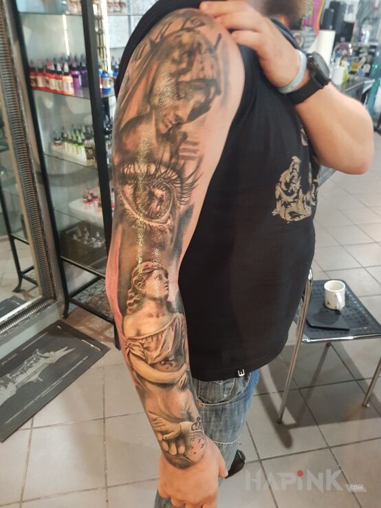 Tattoo Mój pierwszy in angels motif and realistic style on the forearm