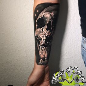 Tattoo Skull on the forearm motif: black and gray style: realistic