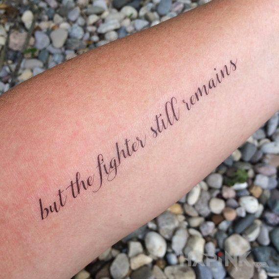 Tattoo Wojownik in lettering motif and calligraphy style on the forearm