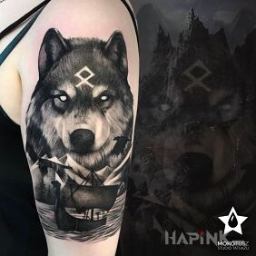 Tattoo Wolf of the North ;) on the upper arm motif: black and gray style: realistic