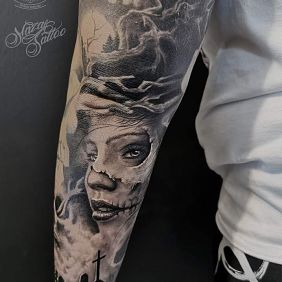 Tattoo Santa Muerte on the forearm motif: demons style: realistic