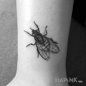 Tattoo Fly on the leg motif: animals style: realistic