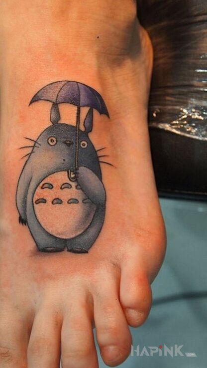 Tattoo Stworek in characters motif on the foot