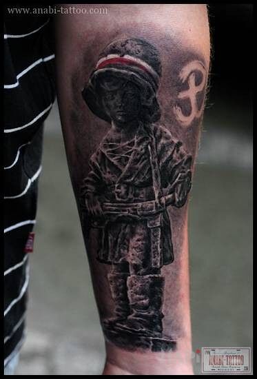 Tattoo Maly powstaniec in patriotic motif on the forearm