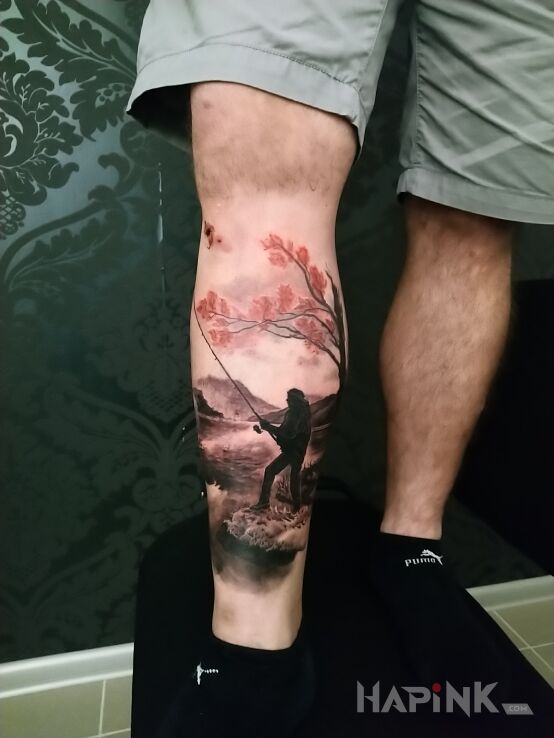 Tattoo Rybak in black and gray motif and realistic style on the leg