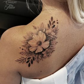 Tattoo Flowers on the back motif: black and gray style: realistic