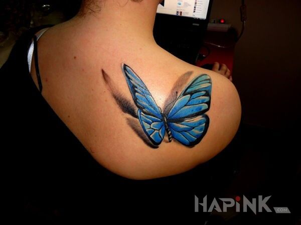 Tattoo Motyl in butterflies motif on the shoulder blades