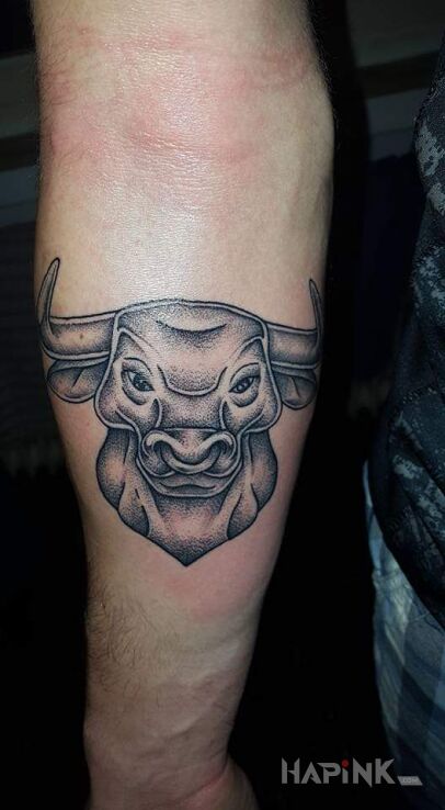 Tattoo Znak zodiaku in black and gray motif and graphic / illustrative style on the forearm