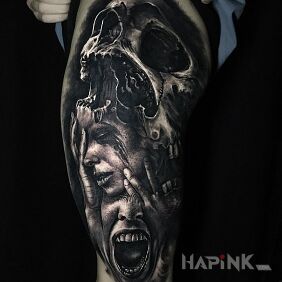 Tattoo Screaming and death on the leg motif: dark style: realistic