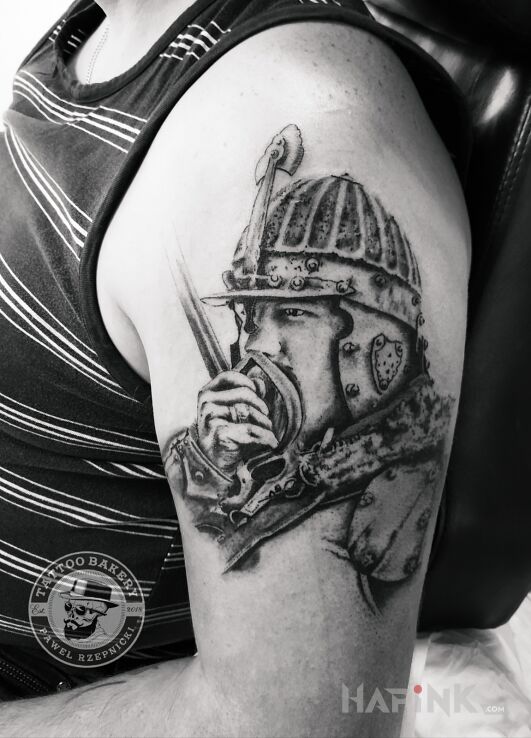 Tattoo Husaria in patriotic motif and realistic style on the upper arm
