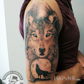 Tattoo Wolf on the upper arm motif: animals style: realistic