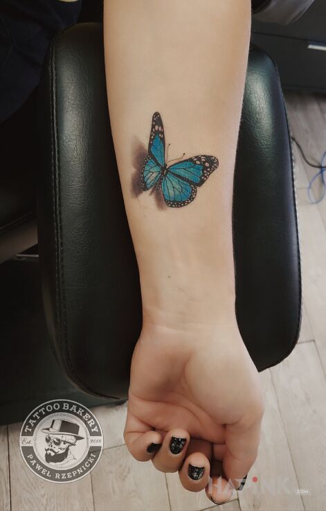 Tattoo Motyl in 3D motif and realistic style on the forearm