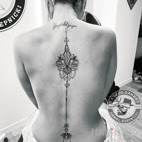 Tattoo Lotus on the back motif: ornaments style: graphic / illustrative