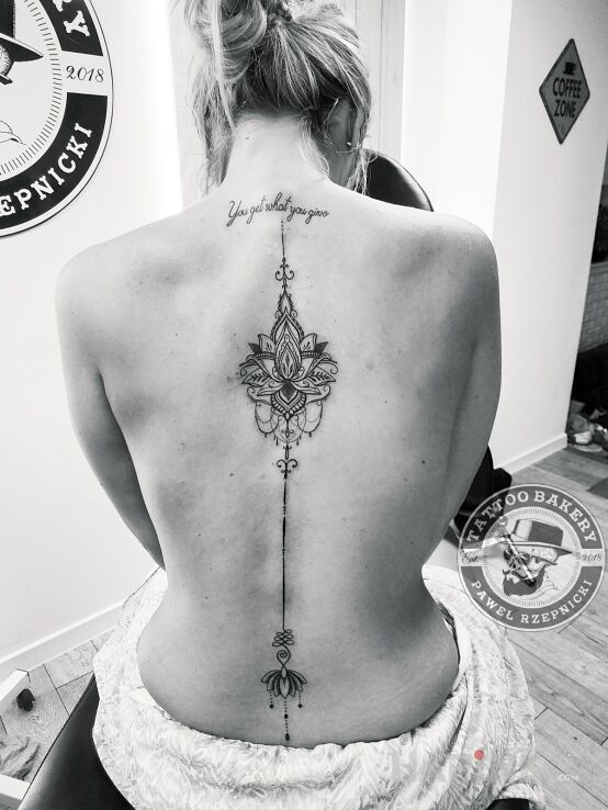 Tattoo Lotos in ornaments motif and graphic / illustrative style on the back