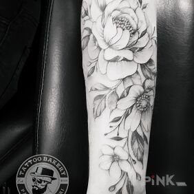 Tattoo Flowers on the forearm motif: black and gray style: graphic / illustrative