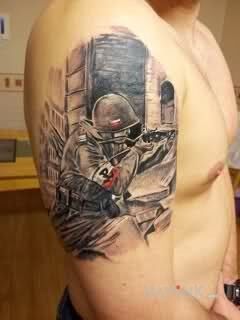 Tattoo Patriotyczny tatuaż in patriotic motif on the upper arm