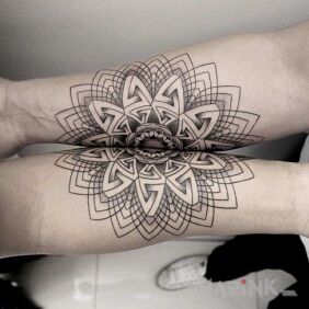 Tattoo Two mandalas on the forearm motif: black and gray style: geometric