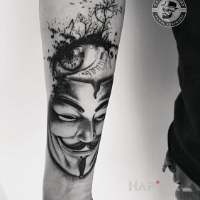 Tattoo Mask on the forearm motif: black and gray style: realistic
