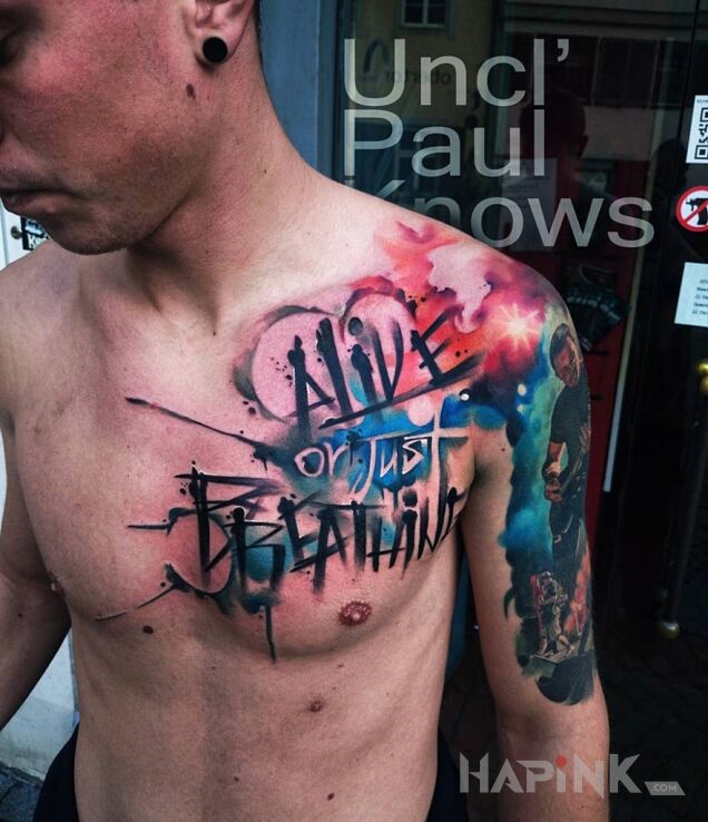 Tattoo Alive or just breathing  in lettering motif on the chest