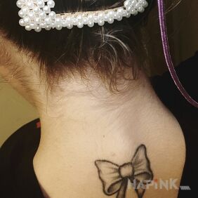Tattoo Cocard on the nape motif: black and gray style: graphic / illustrative