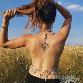 Tattoo Lotus on the back motif: ornaments style: graphic / illustrative