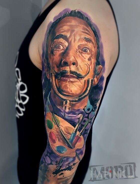 Tattoo Salvador Dali, kolorowy portret in objects motif and realistic style on the upper arm
